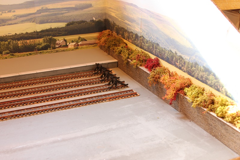 Picture shows platform complete and the first piece of scenic work on the layout.